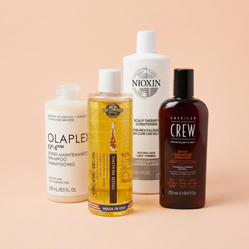 Hair Care: a group of salon products on a light peach pink background