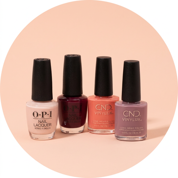 OPI and CND nail colour bottles grouped on light peach pink