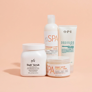 Spa & Body: a group of salon products on a light peach pink background